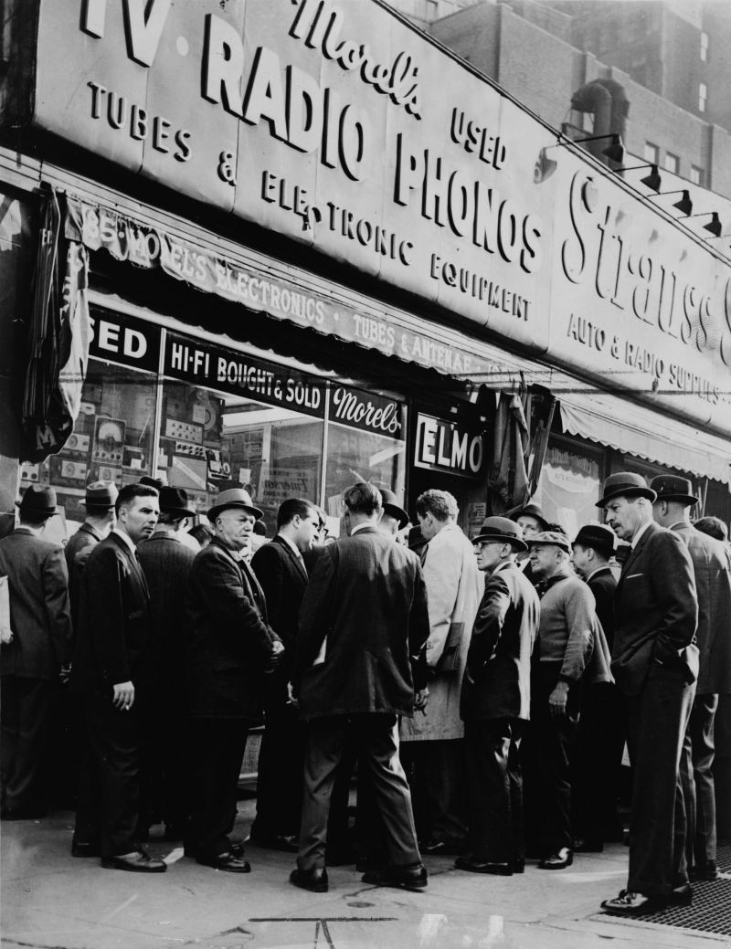 Crowd of People in Front of Radio Row in NYC waiting to buy parts and listening to the radio.